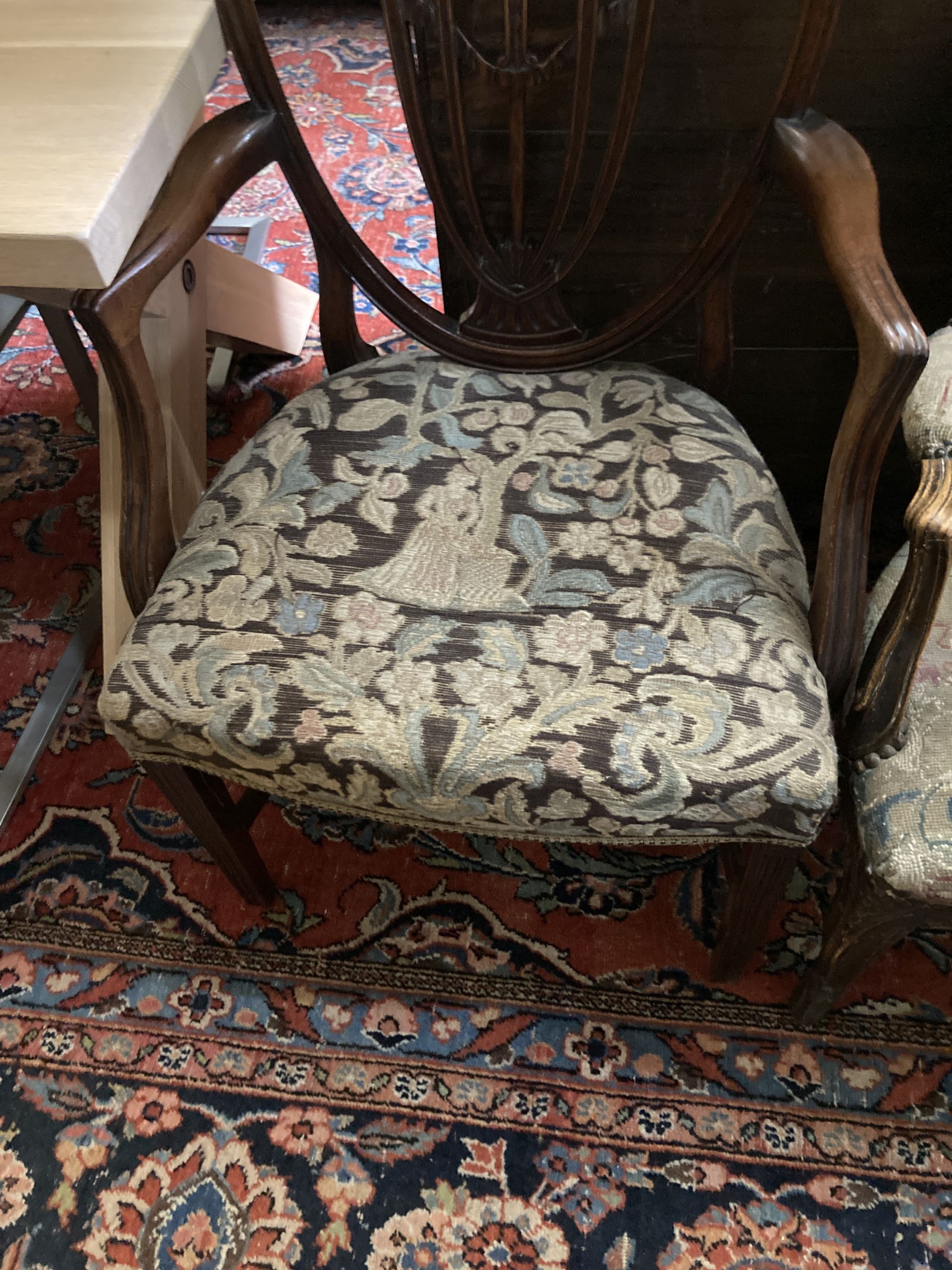 A Hepplewhite style mahogany armchair and a Louis XV walnut fauteuil covered in tapestry